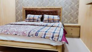 Een bed of bedden in een kamer bij H.A.H Lodges