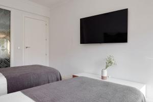 Łóżko lub łóżka w pokoju w obiekcie Soroa Apartment