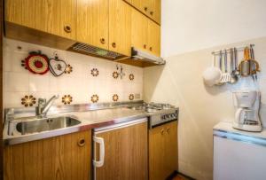 Kuchyňa alebo kuchynka v ubytovaní Apartments Fiordalisi