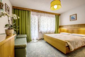 Posteľ alebo postele v izbe v ubytovaní Apartments Fiordalisi