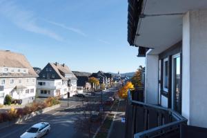 a view from a balcony of a street with a car at Hightop Apartments Winterberg in Winterberg