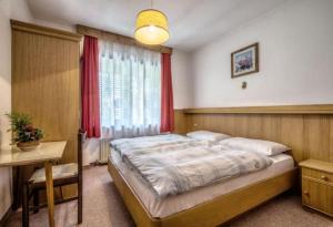 Posteľ alebo postele v izbe v ubytovaní Apartments Fiordalisi