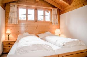 Una cama o camas en una habitación de Apartment Bärhag - GRIWA RENT AG