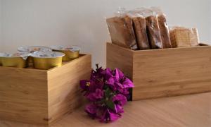 two wooden boxes filled with different types of bread at IL MORO holiday home in Siracusa +54 photos