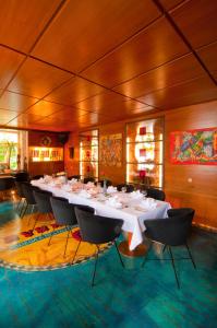 a large dining room with a long table and chairs at Hotel Bären Trossingen in Trossingen