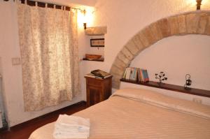 Tempat tidur dalam kamar di Da Marzietta