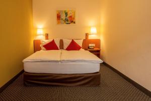 Voodi või voodid majutusasutuse Central Hotel Löwen toas