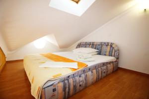 Posteľ alebo postele v izbe v ubytovaní Apartment Pintar Beach