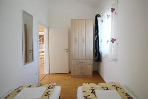 Posteľ alebo postele v izbe v ubytovaní Apartment Pintar Beach
