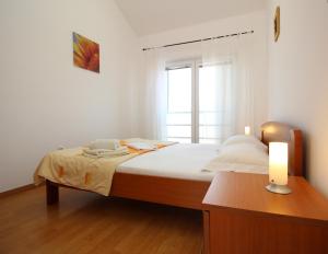 Posteľ alebo postele v izbe v ubytovaní Apartment Pintar Beach