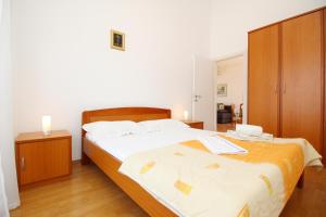 Posteľ alebo postele v izbe v ubytovaní Apartment Pintar Beach
