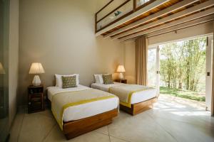 Ένα ή περισσότερα κρεβάτια σε δωμάτιο στο Rukgala Retreat