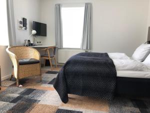 Postel nebo postele na pokoji v ubytování Hotel Skivehus