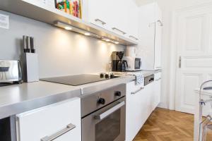 Kuchyň nebo kuchyňský kout v ubytování Design Apartments I contactless check-in
