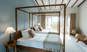 A bed or beds in a room at Rukgala Retreat