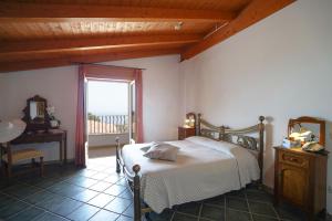 Postel nebo postele na pokoji v ubytování Hotel Residence Costa Azzurra