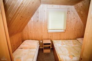 Tempat tidur dalam kamar di Cichy Zakątek