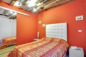 Łóżko lub łóżka w pokoju w obiekcie Fenix Otello Apartments