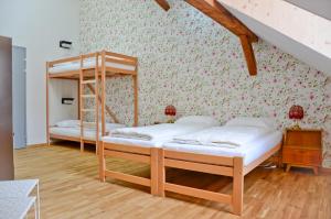 a bedroom with a bed and a dresser at Depot 195 - Hostel Winterthur in Winterthur
