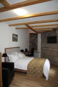 Giường trong phòng chung tại Hotel Hahnmühle 1323