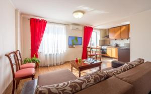 a living room with a couch and a table at Central Dayflat Apartments in Kyiv