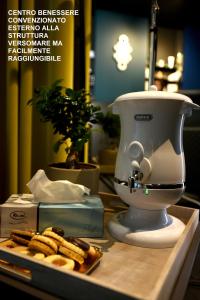 a food processor sitting on a counter with some cookies at Versomare in Polignano a Mare