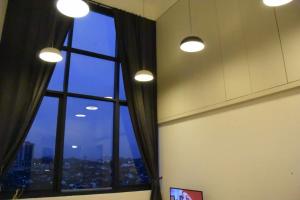 a room with a window with a view of a city at THE HUB SS2 in Petaling Jaya