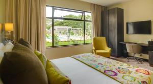 Katil atau katil-katil dalam bilik di Tamarind Tree Hotel