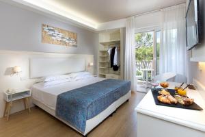 Postel nebo postele na pokoji v ubytování Hotel Croce Di Malta