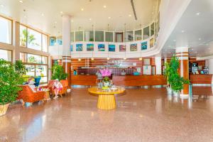 a lobby with people sitting in chairs in a building at VONRESORT Golden Beach & Aqua - Kids Concept-Ultra All Inclusive in Side