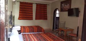 מיטה או מיטות בחדר ב-Hotel Wissam