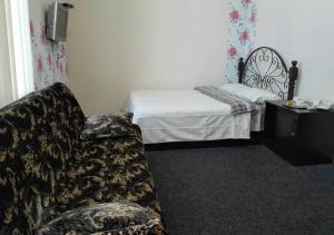 Postel nebo postele na pokoji v ubytování Voskhod Hotel
