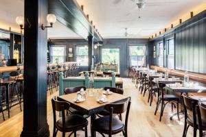 a row of tables and chairs in a restaurant at Olema House at Point Reyes in Olema