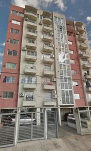 a tall apartment building with a lot of balconies at Confort & Relax in Mariano J. Haedo