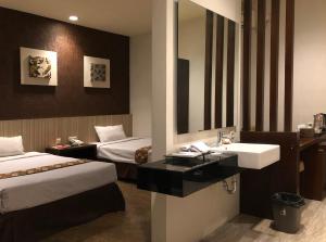 Letto o letti in una camera di Hotel Sinar 1
