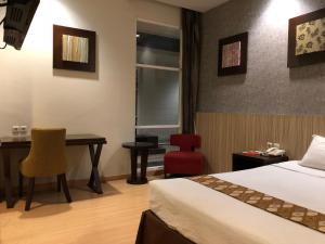 Letto o letti in una camera di Hotel Sinar 1