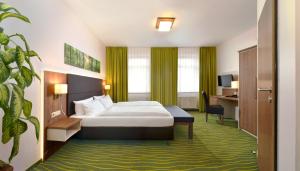Postel nebo postele na pokoji v ubytování Hotel Meyer