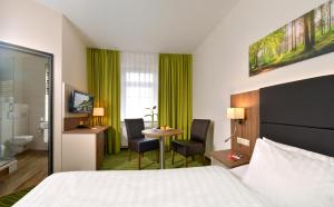Postel nebo postele na pokoji v ubytování Hotel Meyer