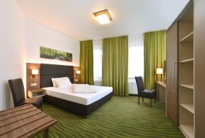 Postel nebo postele na pokoji v ubytování Hotel Meyer