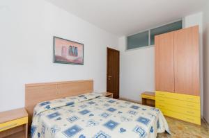 A bed or beds in a room at Corimbo