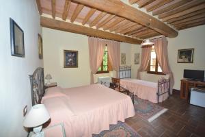 Tempat tidur dalam kamar di Antica Fattoria La Verdina