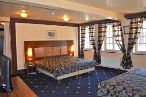 Ein Bett oder Betten in einem Zimmer der Unterkunft Hotel Petr
