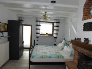 Postel nebo postele na pokoji v ubytování Kaminstübchen