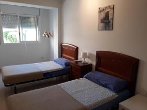 Cama o camas de una habitación en Apartment Verge de Montserrat