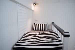 Postel nebo postele na pokoji v ubytování Lovi Time B&B