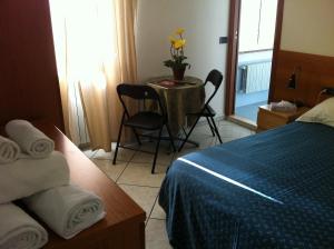 Postel nebo postele na pokoji v ubytování Hotel Pontenuovo