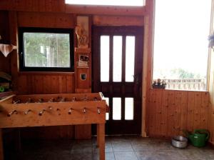 a room with a wooden room with a table and a window at Ferienhof Kriechbaumer in Schönau im Mühlkreis