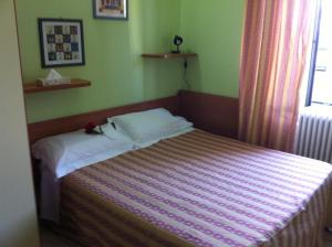 Postel nebo postele na pokoji v ubytování Hotel Pontenuovo