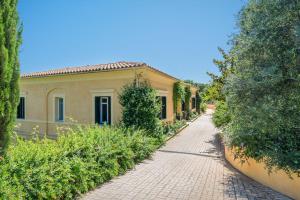 a brick road in front of a house at VILLA MYLOS in Danilia