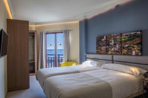 Postel nebo postele na pokoji v ubytování Hotel Castillete + 20 fotografií